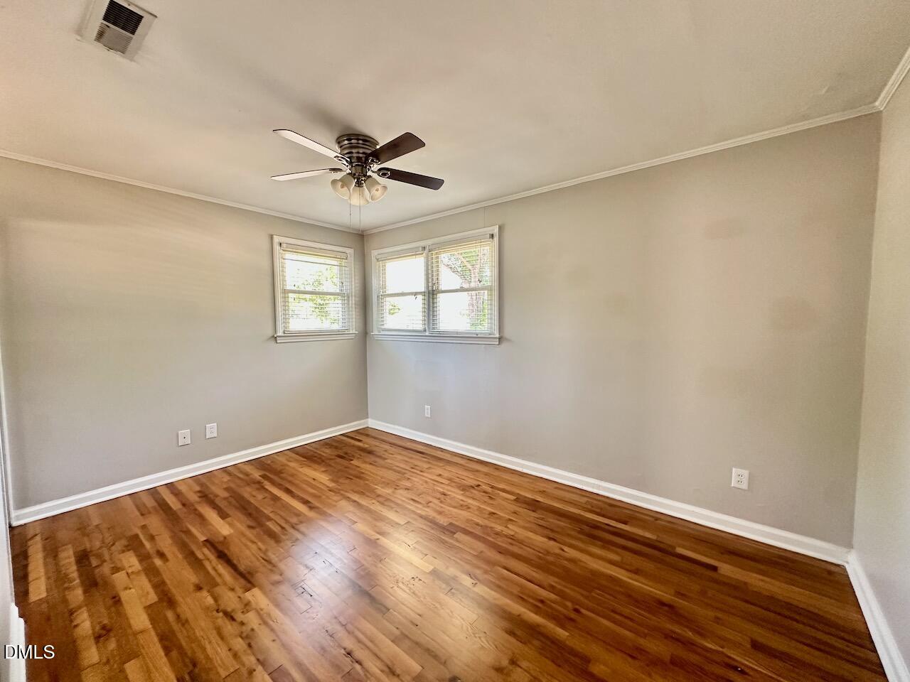 2333 Bernard Street Raleigh, NC 27608 - Photo 13 of 19 wooden floor in an empty room with a window