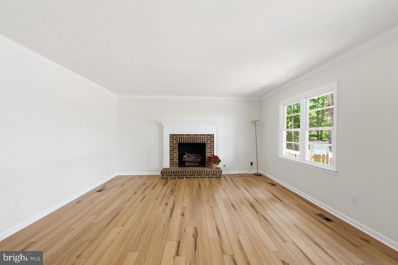 7100 Counter Place Burke, VA 22015 - Photo 12 of 54 21x15 family room, gas FP, glass door to deck