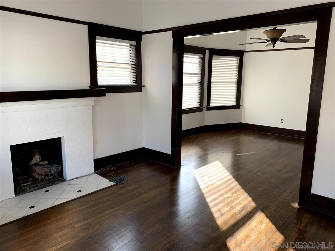 838 21st Street San Diego, CA 92102 - Photo 14 of 16 a view of an empty room with wooden floor and a window