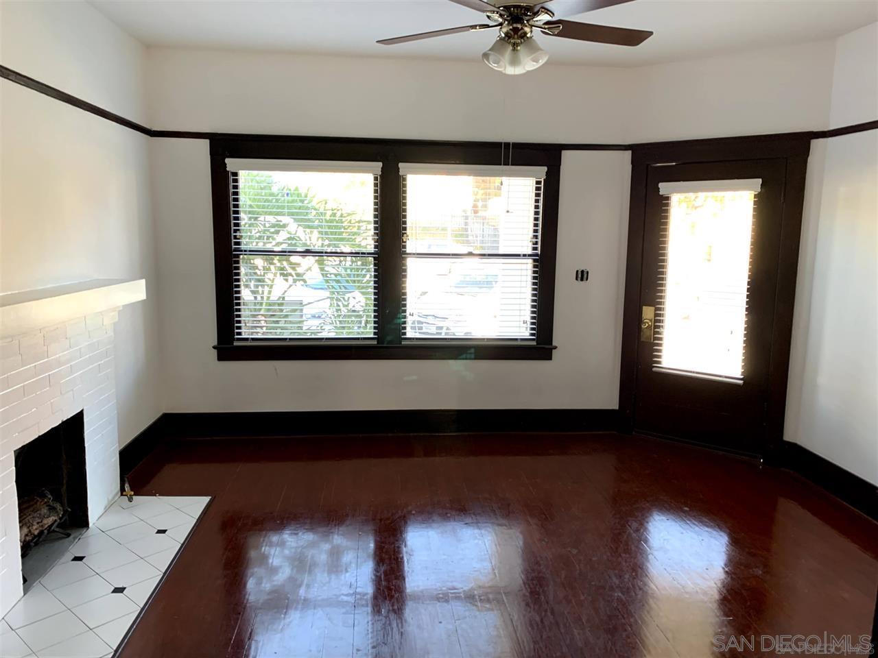 838 21st Street San Diego, CA 92102 - Photo 6 of 16 a living room with hardwood floor a ceiling fan and a window