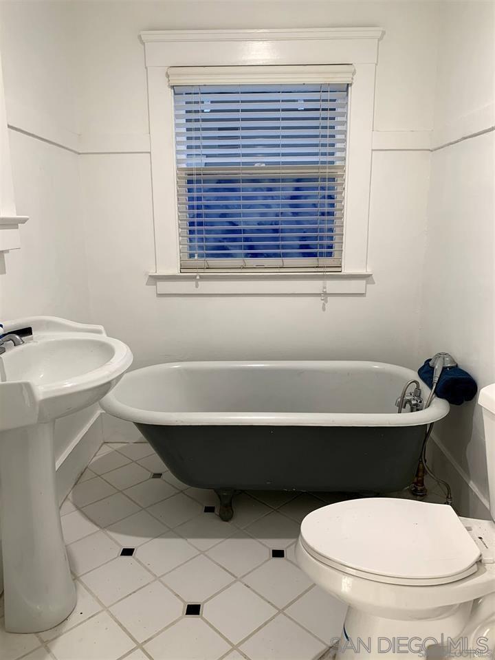 838 21st Street San Diego, CA 92102 - Photo 9 of 16 a bathroom with a toilet a sink and a window