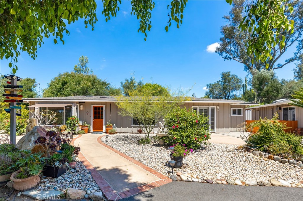 a front view of house and yard with seating space