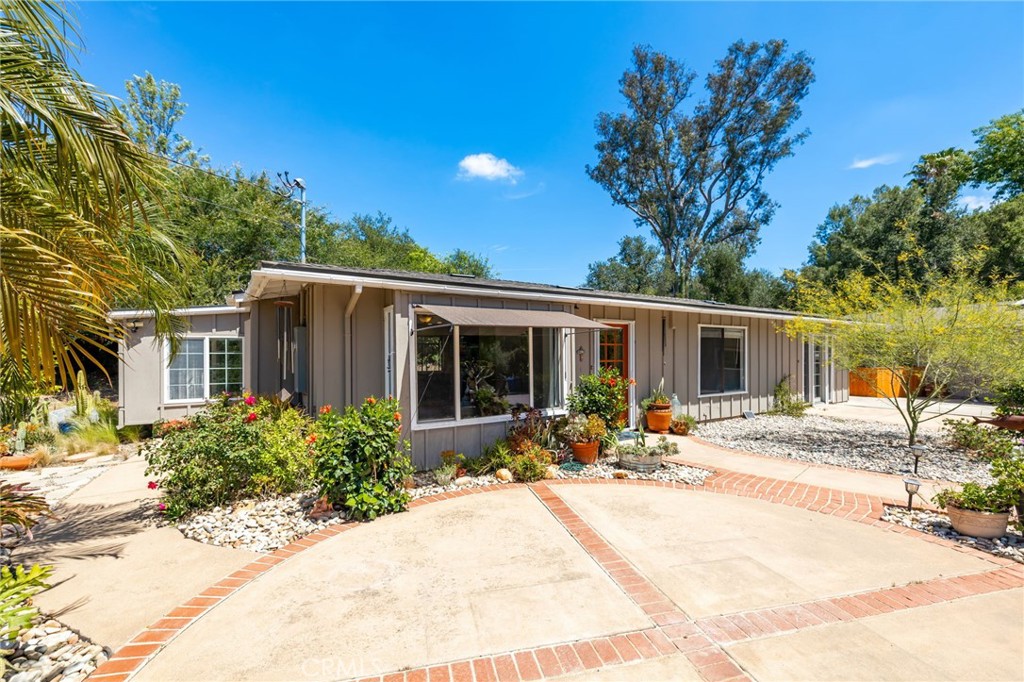 1256 East Fallbrook Street Fallbrook, CA 92028 - Photo 2 of 59 a front view of a house with a patio
