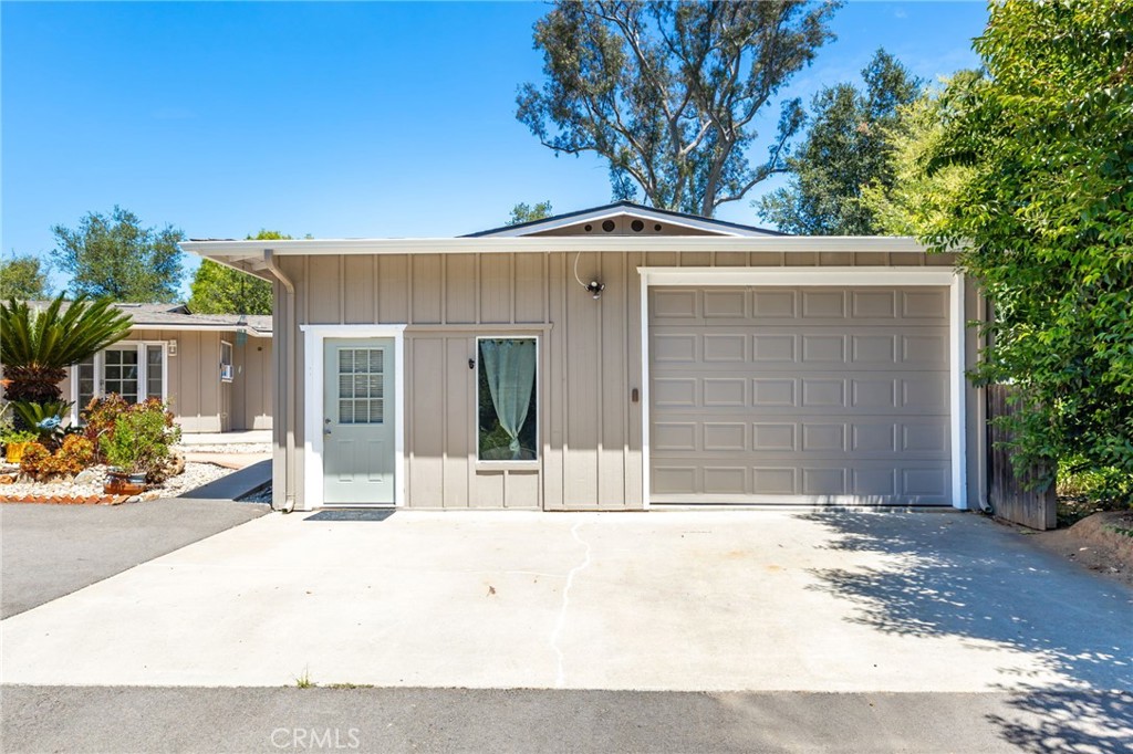 1256 East Fallbrook Street Fallbrook, CA 92028 - Photo 43 of 59 a front view of a house with a garden