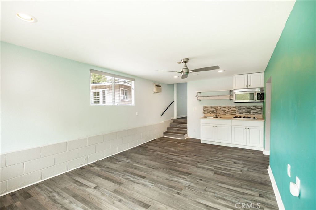 1256 East Fallbrook Street Fallbrook, CA 92028 - Photo 48 of 59 a view of a kitchen with wooden floor and electronic appliances