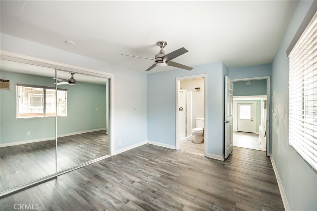1256 East Fallbrook Street Fallbrook, CA 92028 - Photo 51 of 59 a view of an empty room and window and wooden floor