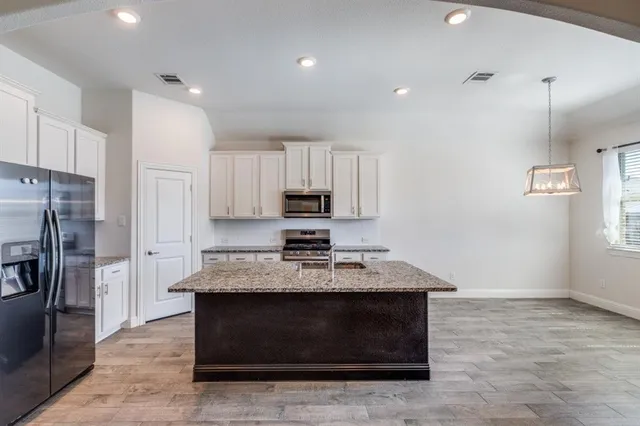 a view of a house with a yard and garage