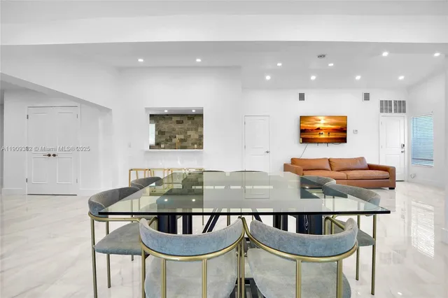 a view of a dining area with furniture window and outside view