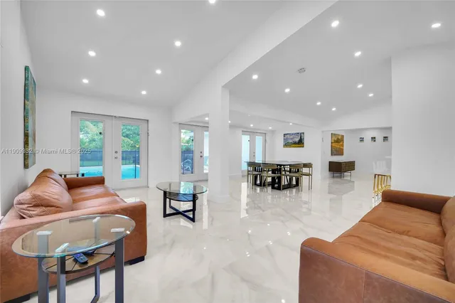 a bedroom with two beds and a couch