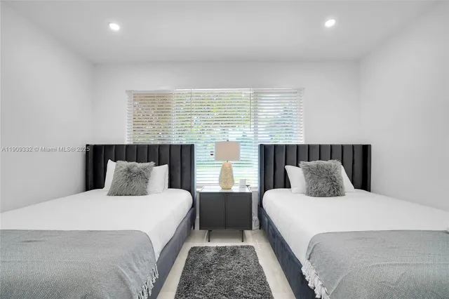 a bathroom with a sink a vanity and a shower