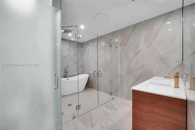 a bathroom with a bathtub and shower
