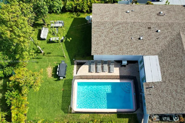 a view of swimming pool with lounge chair
