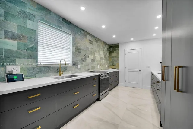 a kitchen with a sink and refrigerator