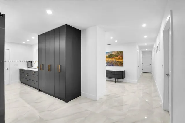 a large bathroom with a sink and a large mirror