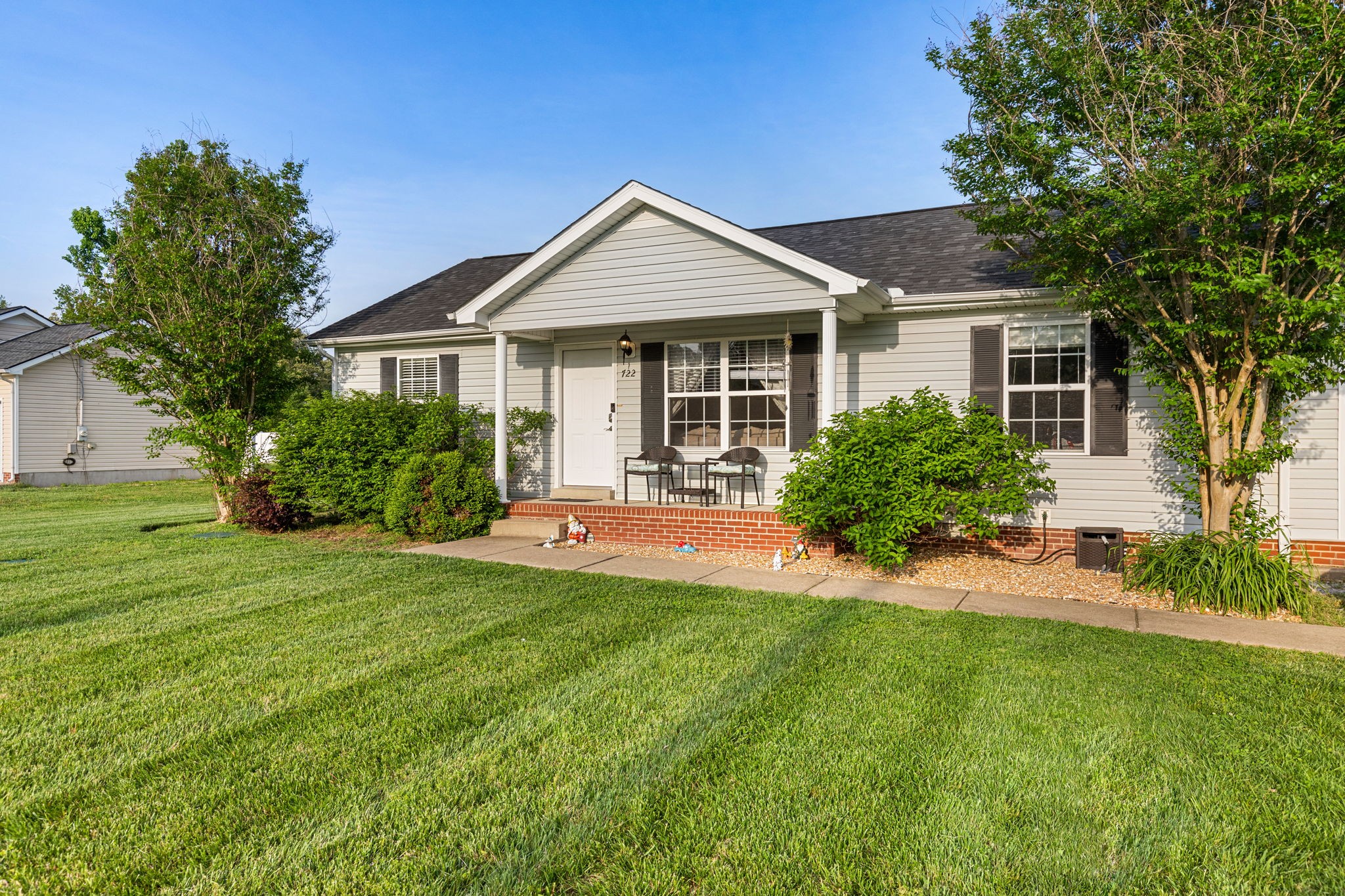 722 Eaglesham Drive Christiana, TN 37037 - Photo 2 of 29 a front view of a house with a yard and potted plants
