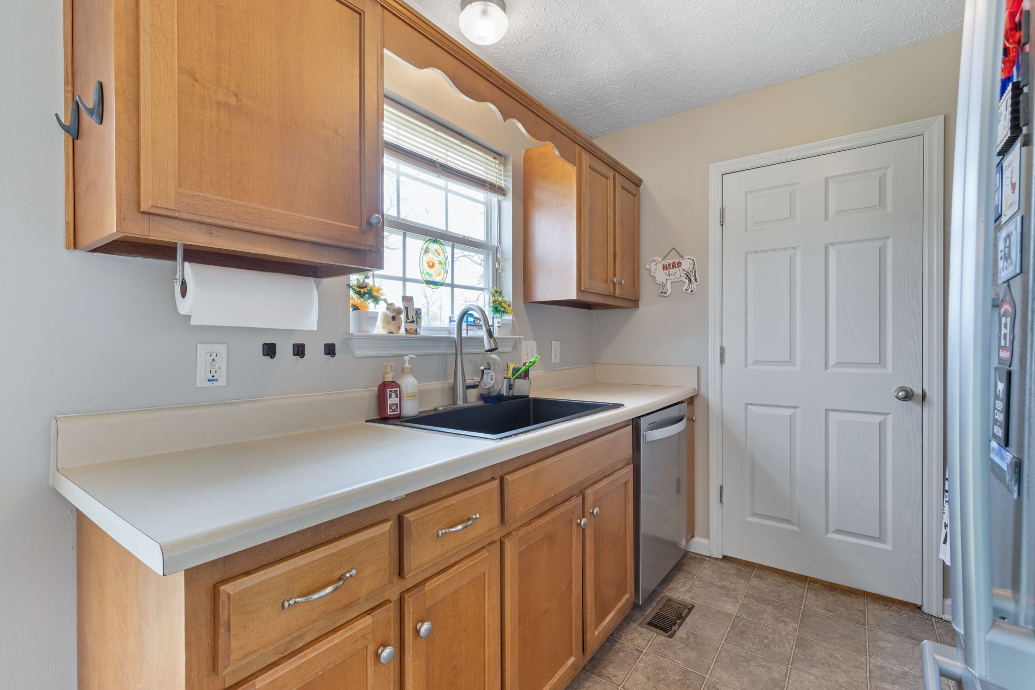 722 Eaglesham Drive Christiana, TN 37037 - Photo 6 of 29 a kitchen with cabinets appliances a sink and a window