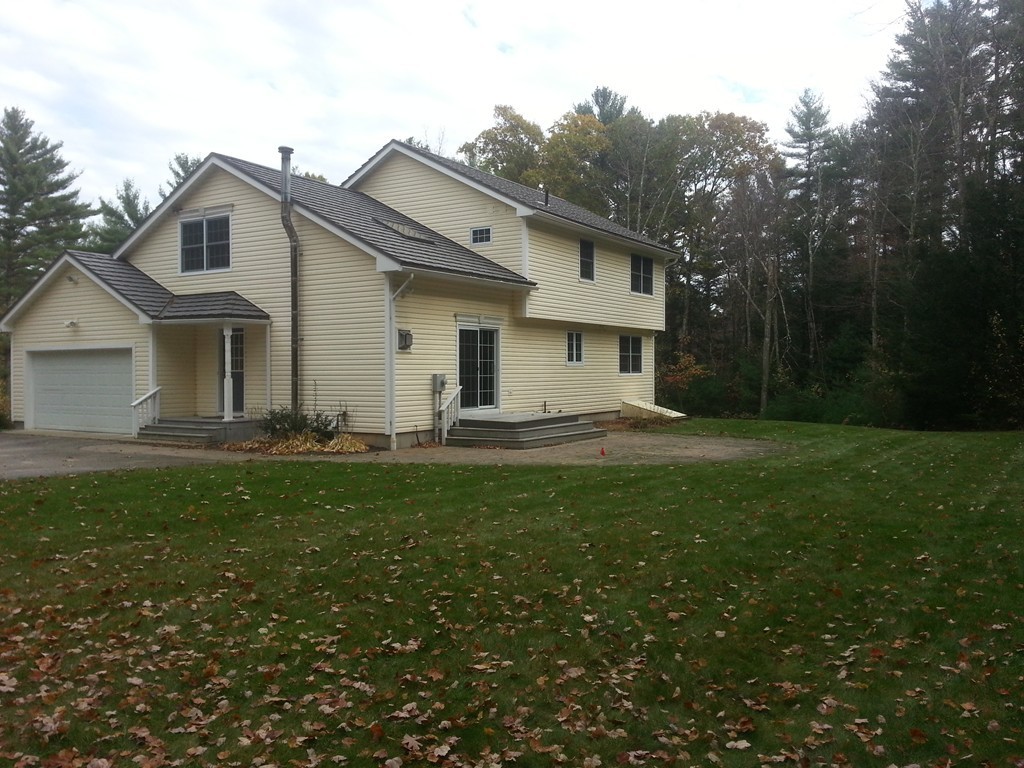 68 Dugan Road Ware, MA 01082 - Photo 5 of 25 a front view of a house with a garden