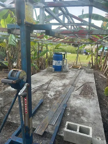 a view of a water fountain with large trees
