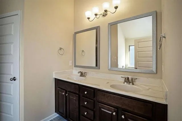 a bathroom with bathtub and window