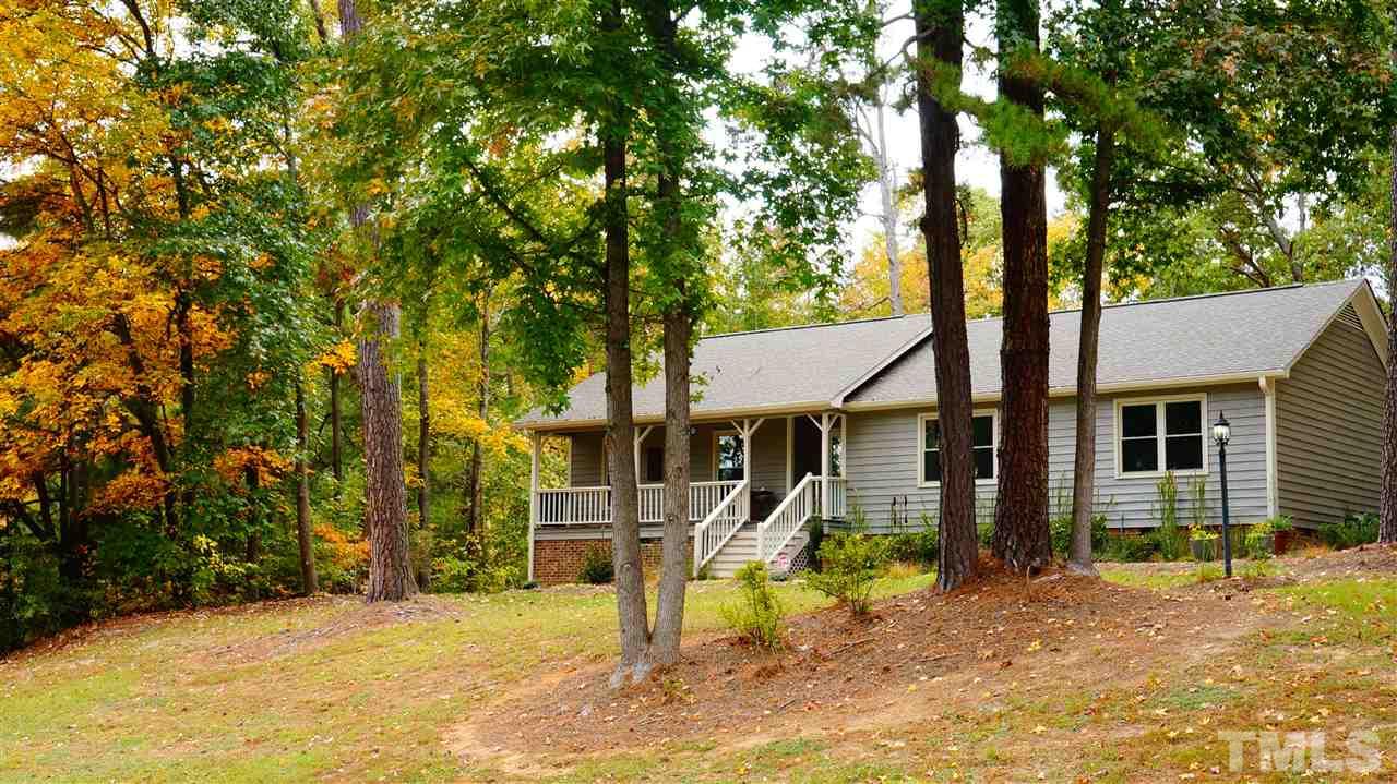 1030 Prologue Road Durham, NC 27712 - Photo 1 of 18 a view of a house with a yard