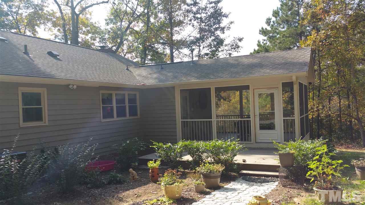 1030 Prologue Road Durham, NC 27712 - Photo 14 of 18 a house with a flower garden