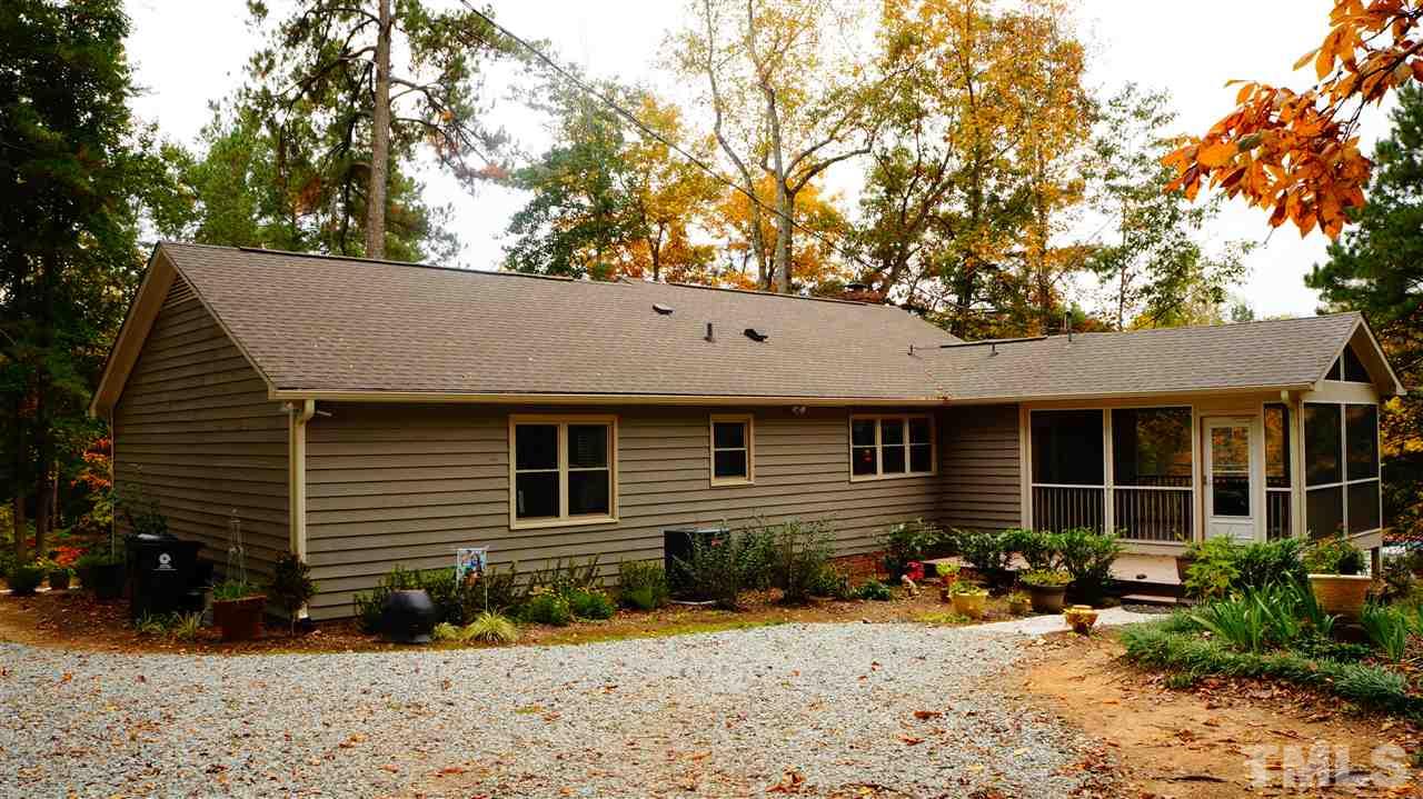 1030 Prologue Road Durham, NC 27712 - Photo 16 of 18 a front view of a house with a yard