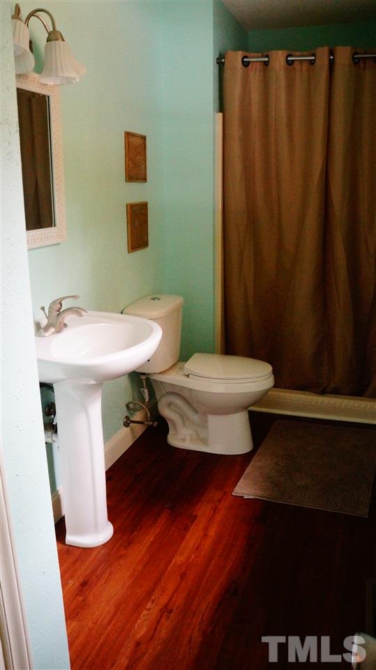 1030 Prologue Road Durham, NC 27712 - Photo 9 of 18 a bathroom with a sink toilet and a mirror