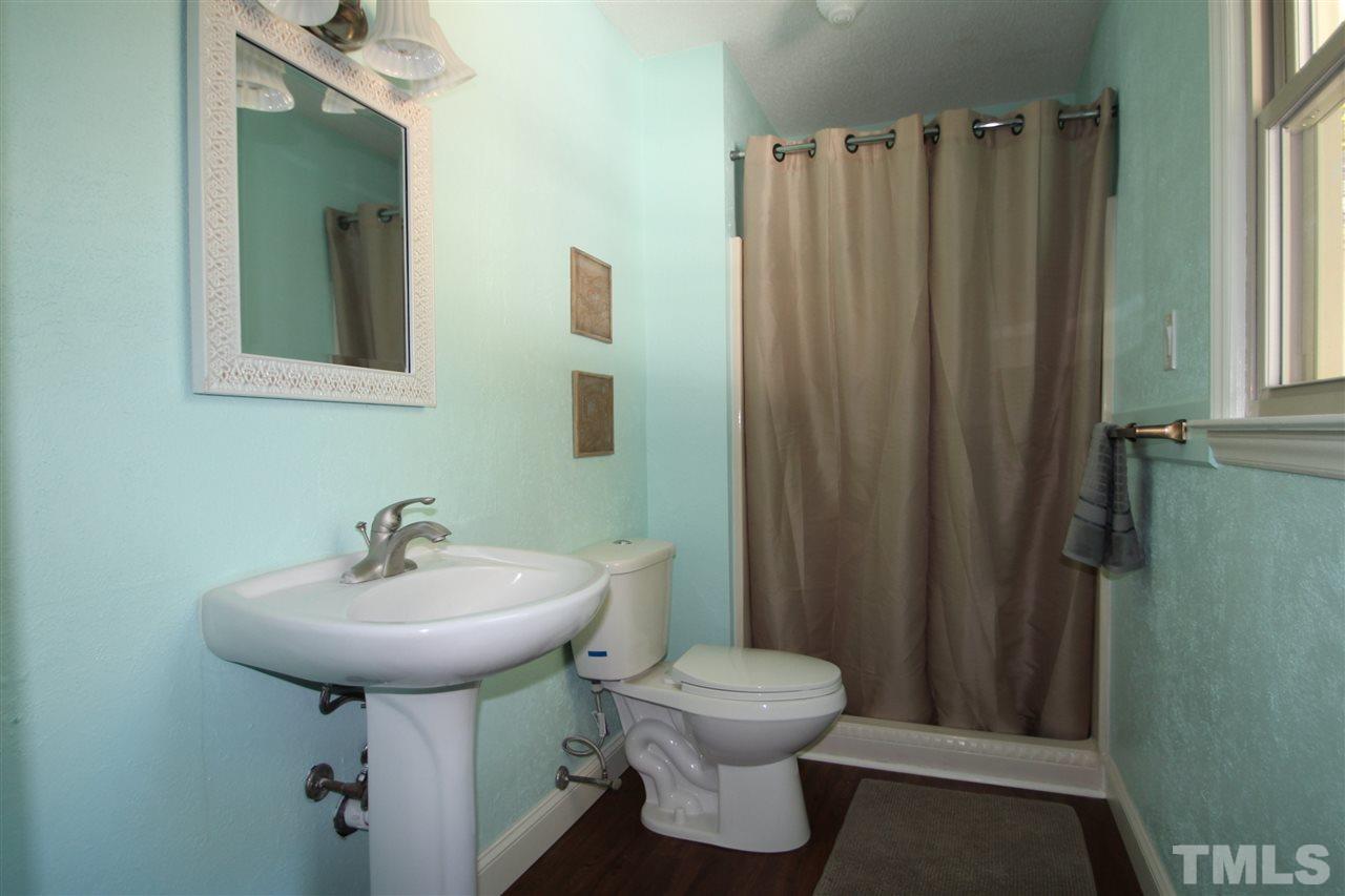 1030 Prologue Road Durham, NC 27712 - Photo 10 of 18 a bathroom with a sink toilet and shower