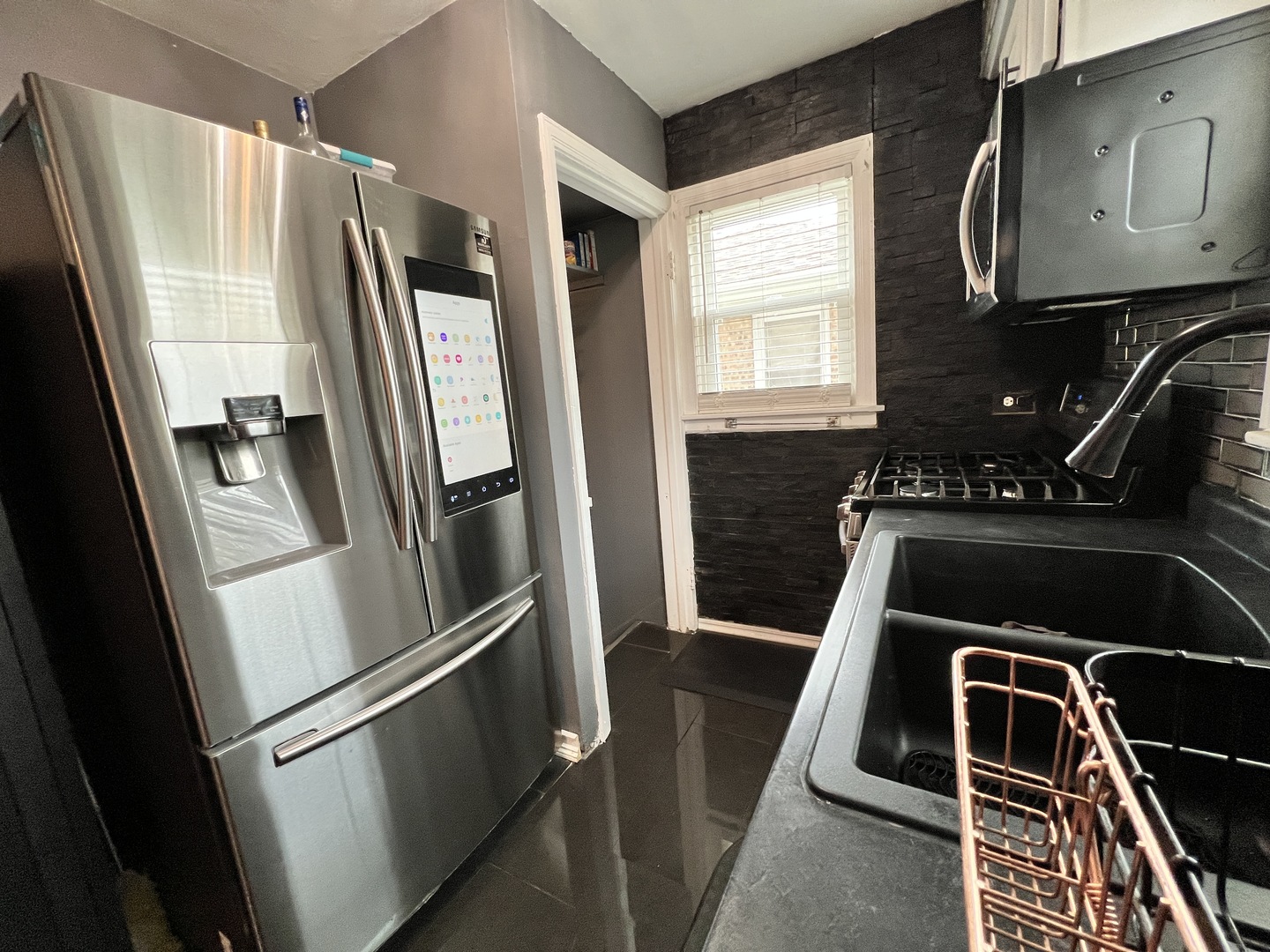 12240 South Racine Avenue Chicago, IL 60643 - Photo 3 of 14 a kitchen with a refrigerator and a window