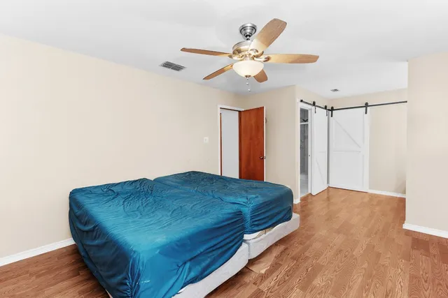 a bathroom with a shower and toilet