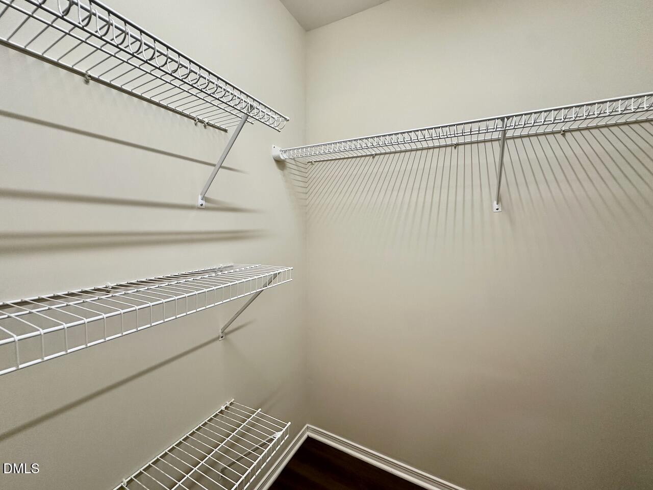 8208 Stone Cellar Drive Raleigh, NC 27613 - Photo 24 of 34 a view of a room with racks on the wall