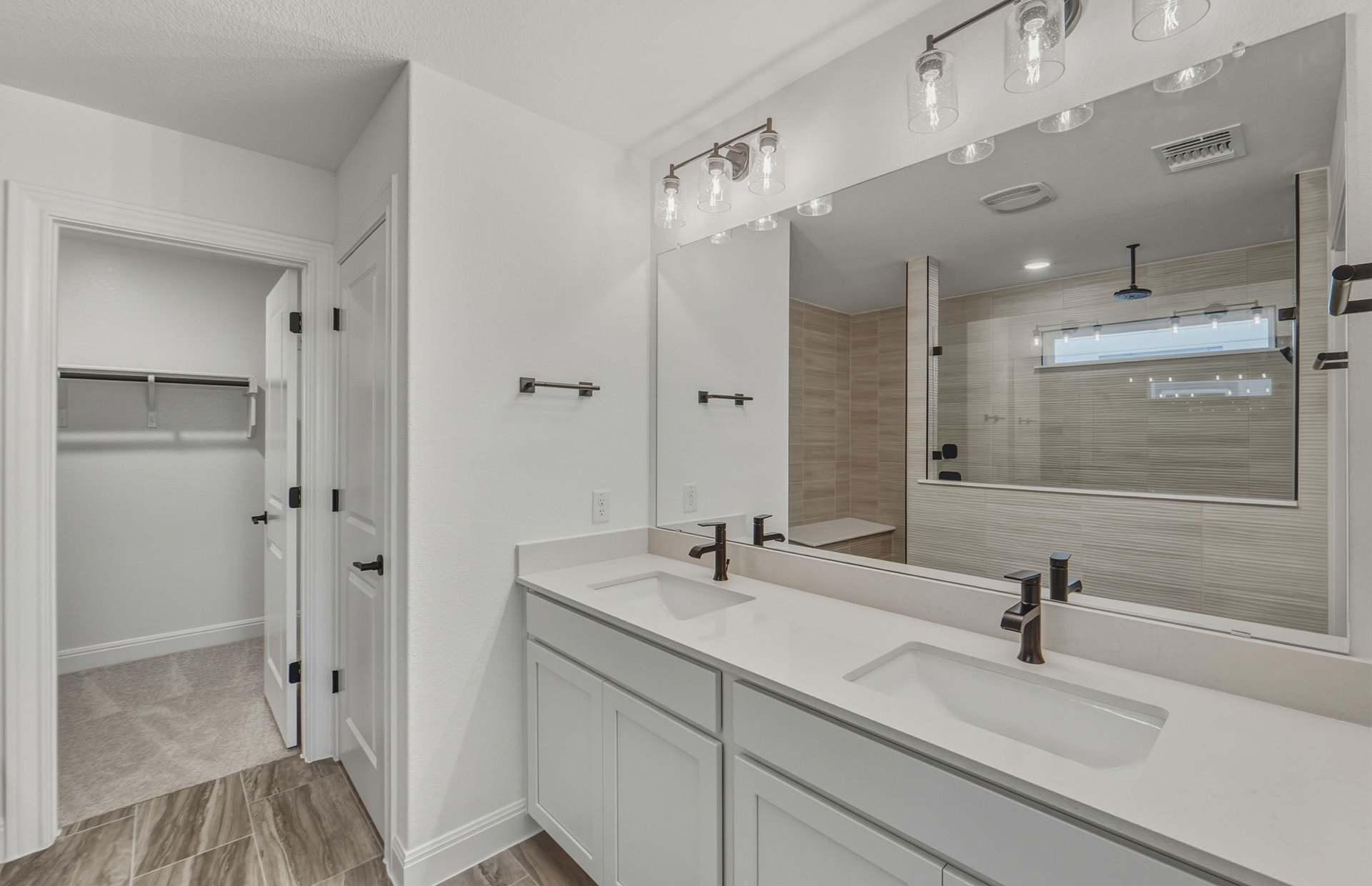 456 Foresail Road Leander, TX 78641 - Photo 11 of 22 a bathroom with a sink shower and a mirror