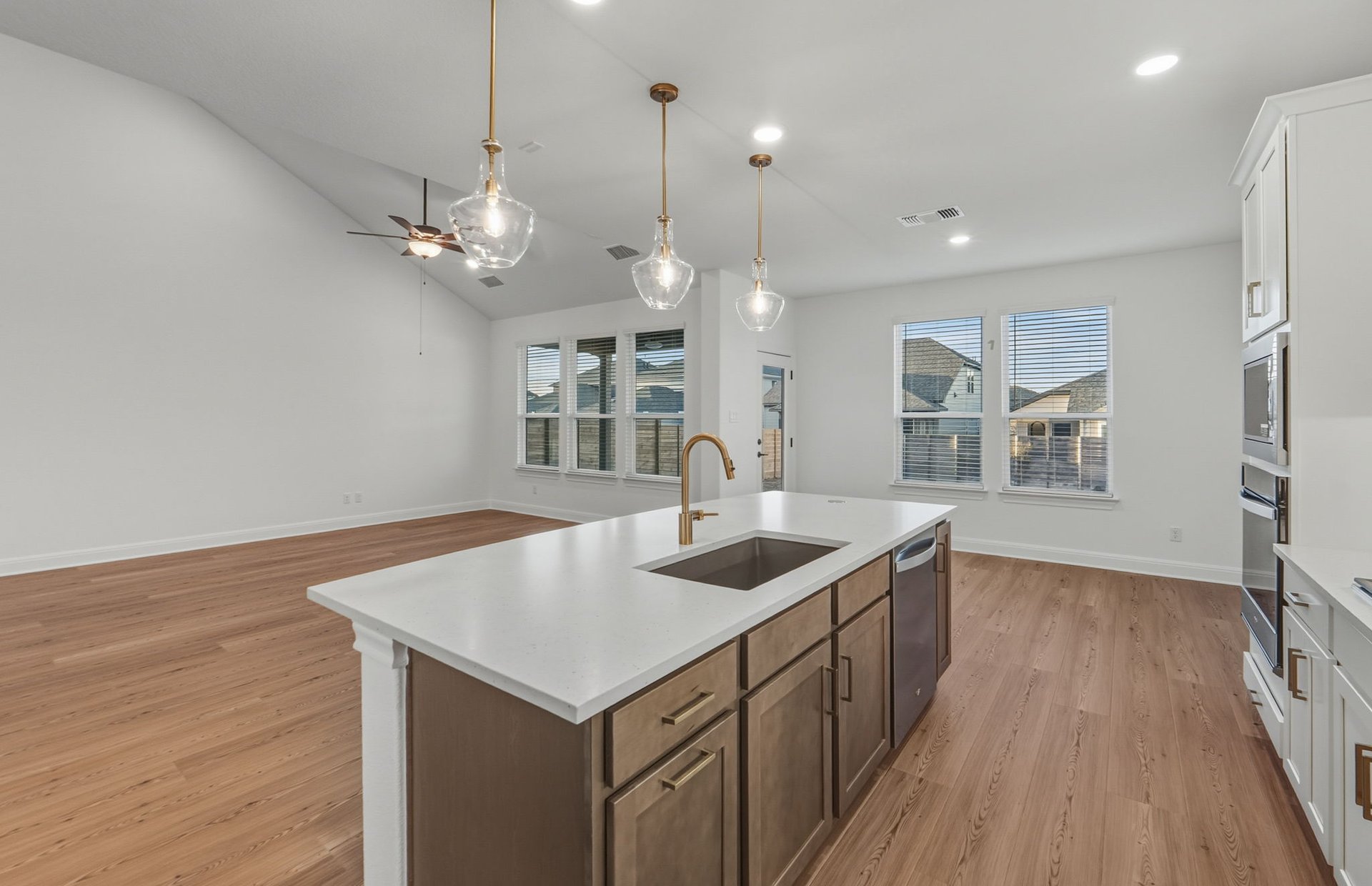 456 Foresail Road Leander, TX 78641 - Photo 4 of 22 an open kitchen with a sink and dish washer