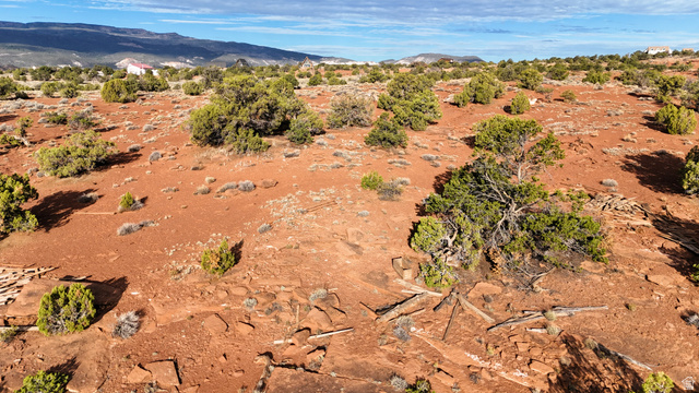 358 South Sky Drive Torrey, UT 84775 - Photo 60 of 82 Expansive undeveloped land featuring natural red earth, scattered green scrub brush, and distant mountainous terrain