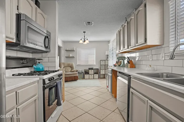 a bedroom with a bed and cabinet