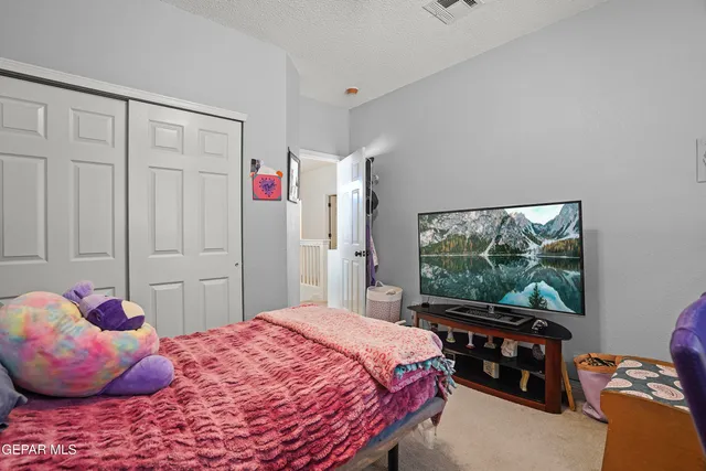 a view of a house with swimming pool and sitting area