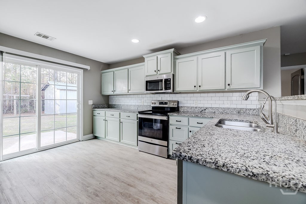 190 Cypress Cove Lane Rincon, GA 31326 - Photo 13 of 37 kitchen to back door