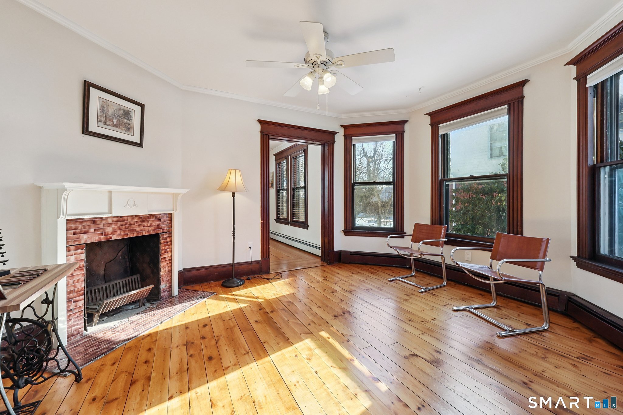 56 Whitney Street Hartford, CT 06105 - Photo 11 of 40 a living room with furniture and a fireplace
