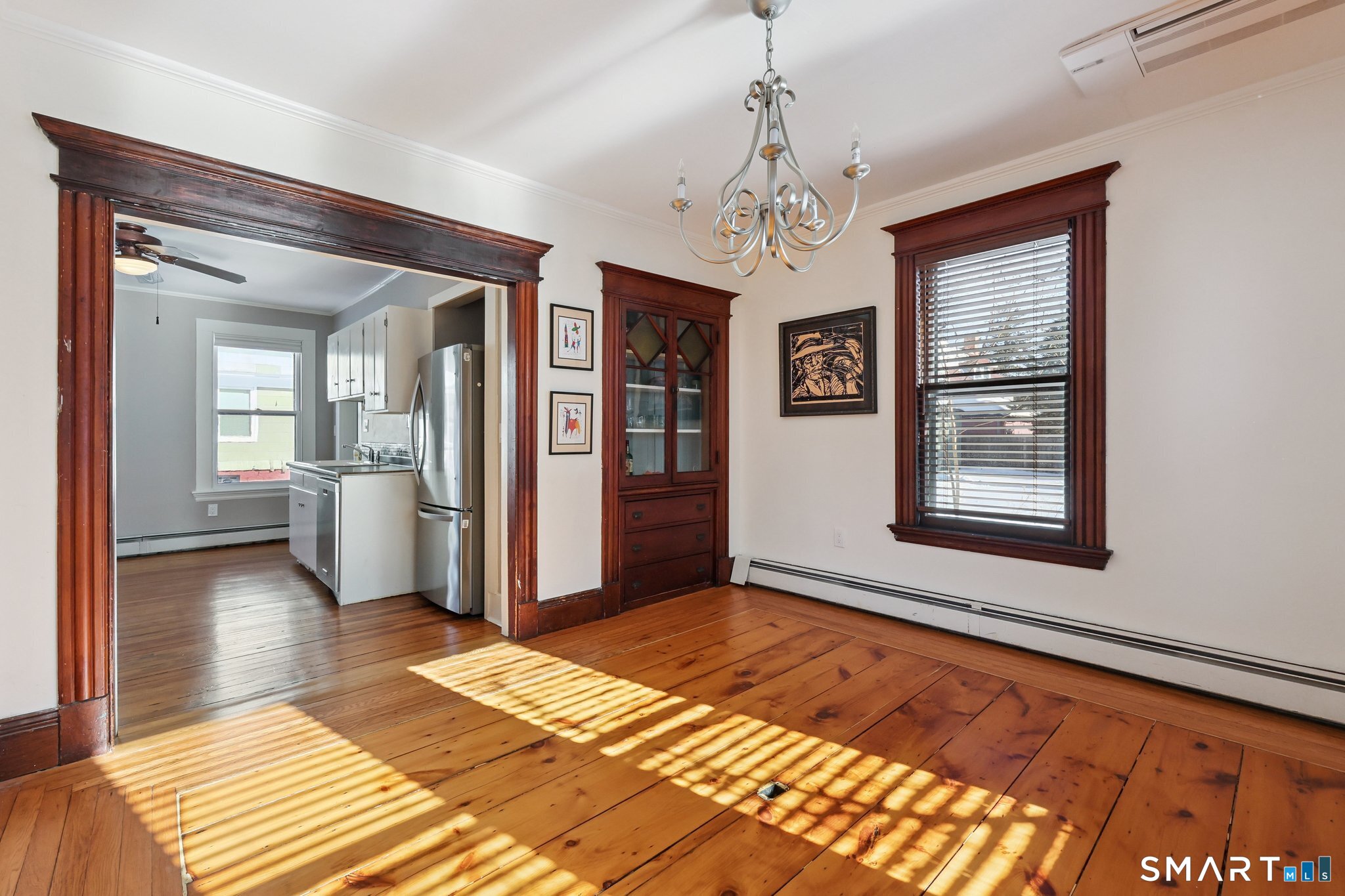 56 Whitney Street Hartford, CT 06105 - Photo 15 of 40 a view of a room with a chandelier and wooden floor