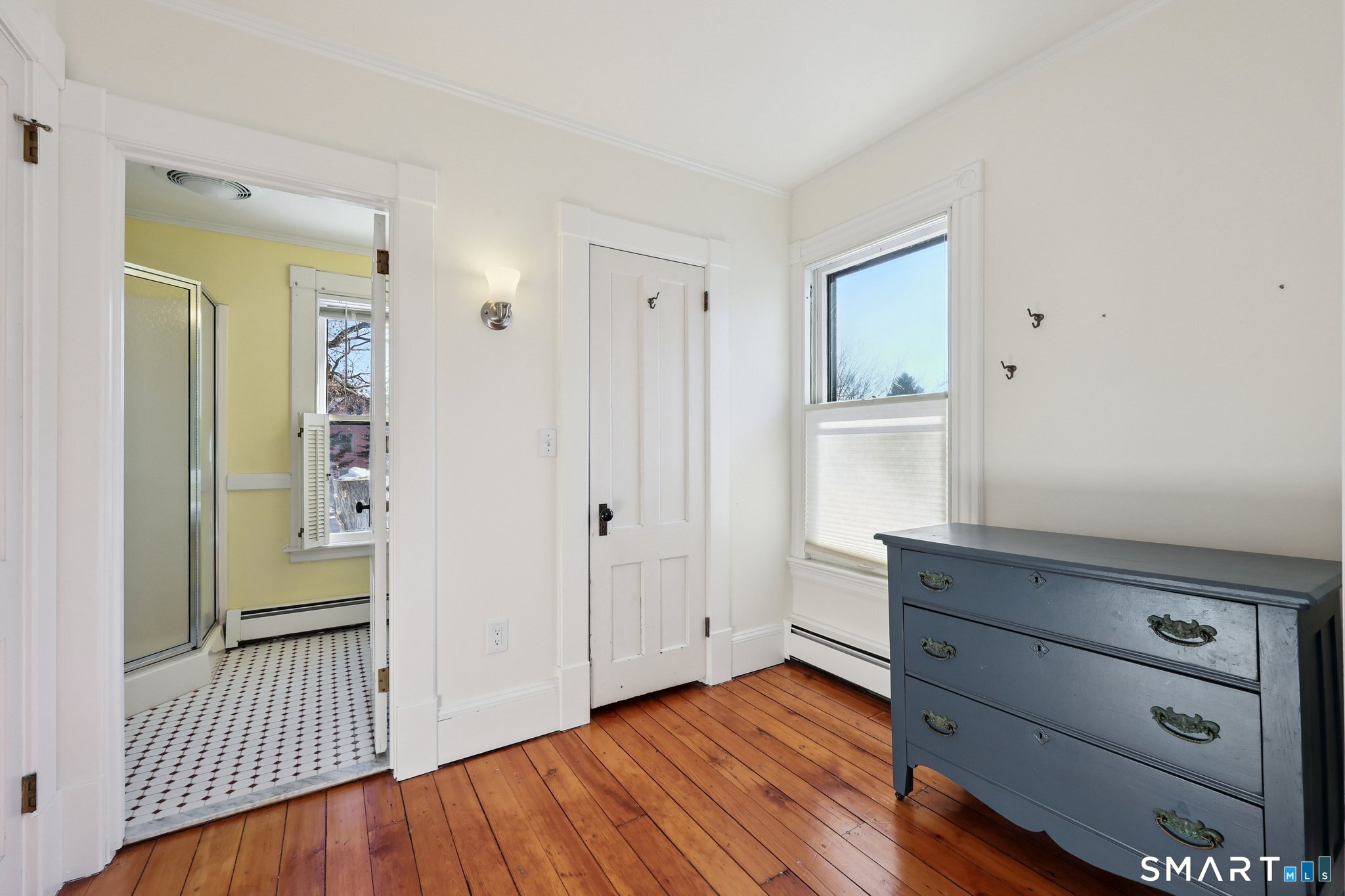 56 Whitney Street Hartford, CT 06105 - Photo 26 of 40 a view of a hallway with wooden floor and closet