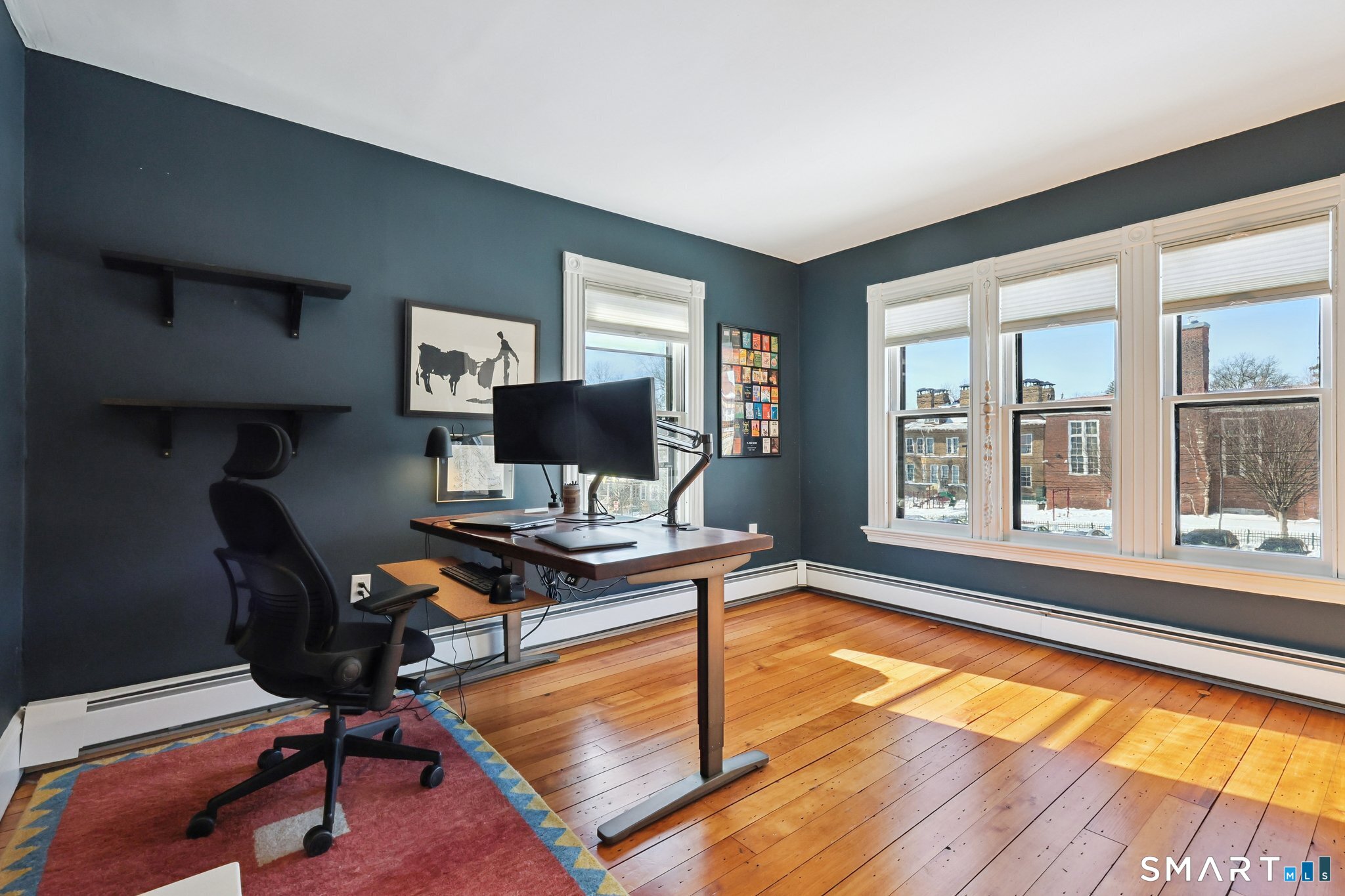 56 Whitney Street Hartford, CT 06105 - Photo 28 of 40 a view of a workspace with furniture and a window