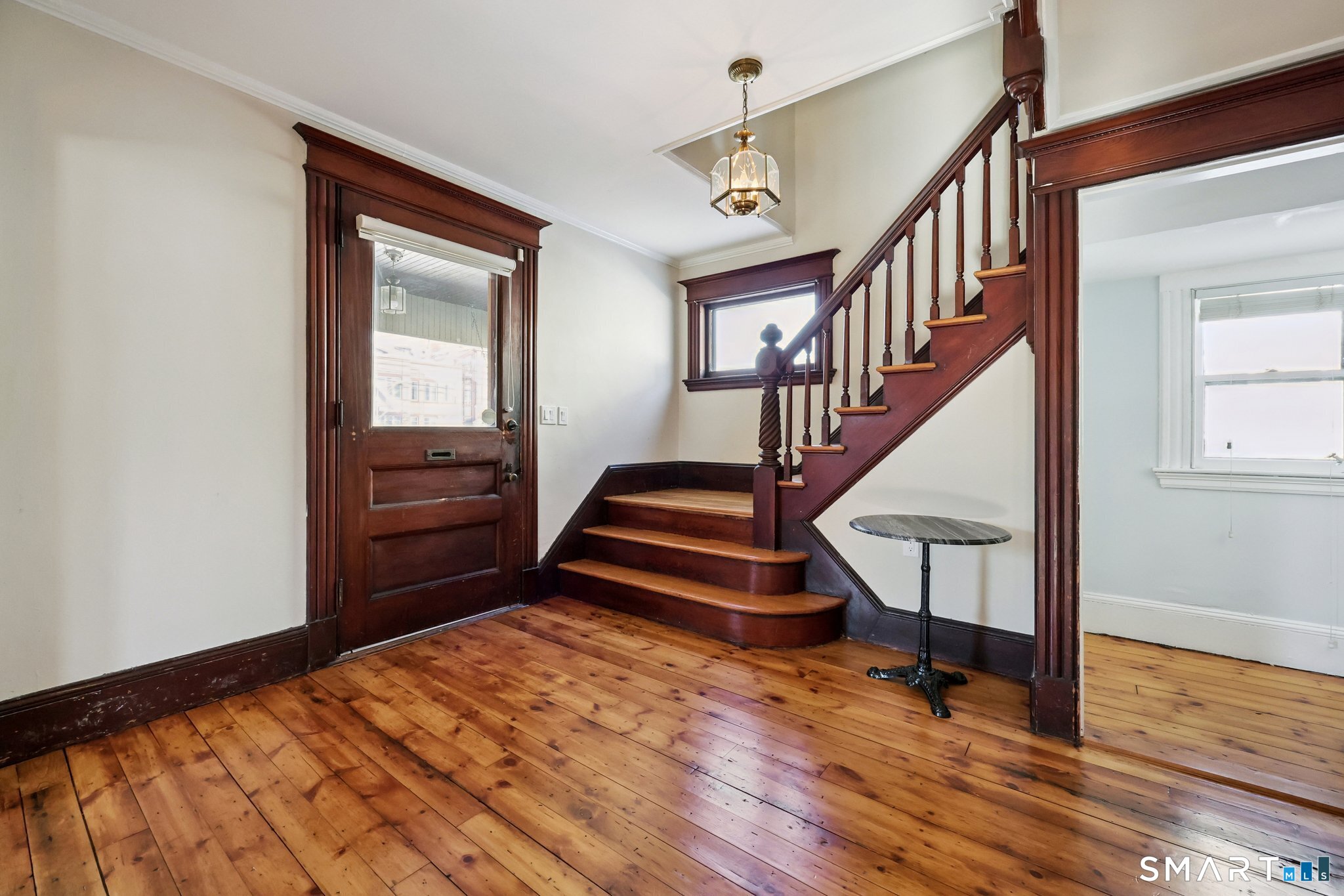 56 Whitney Street Hartford, CT 06105 - Photo 5 of 40 a view of entryway and hall with wooden floor