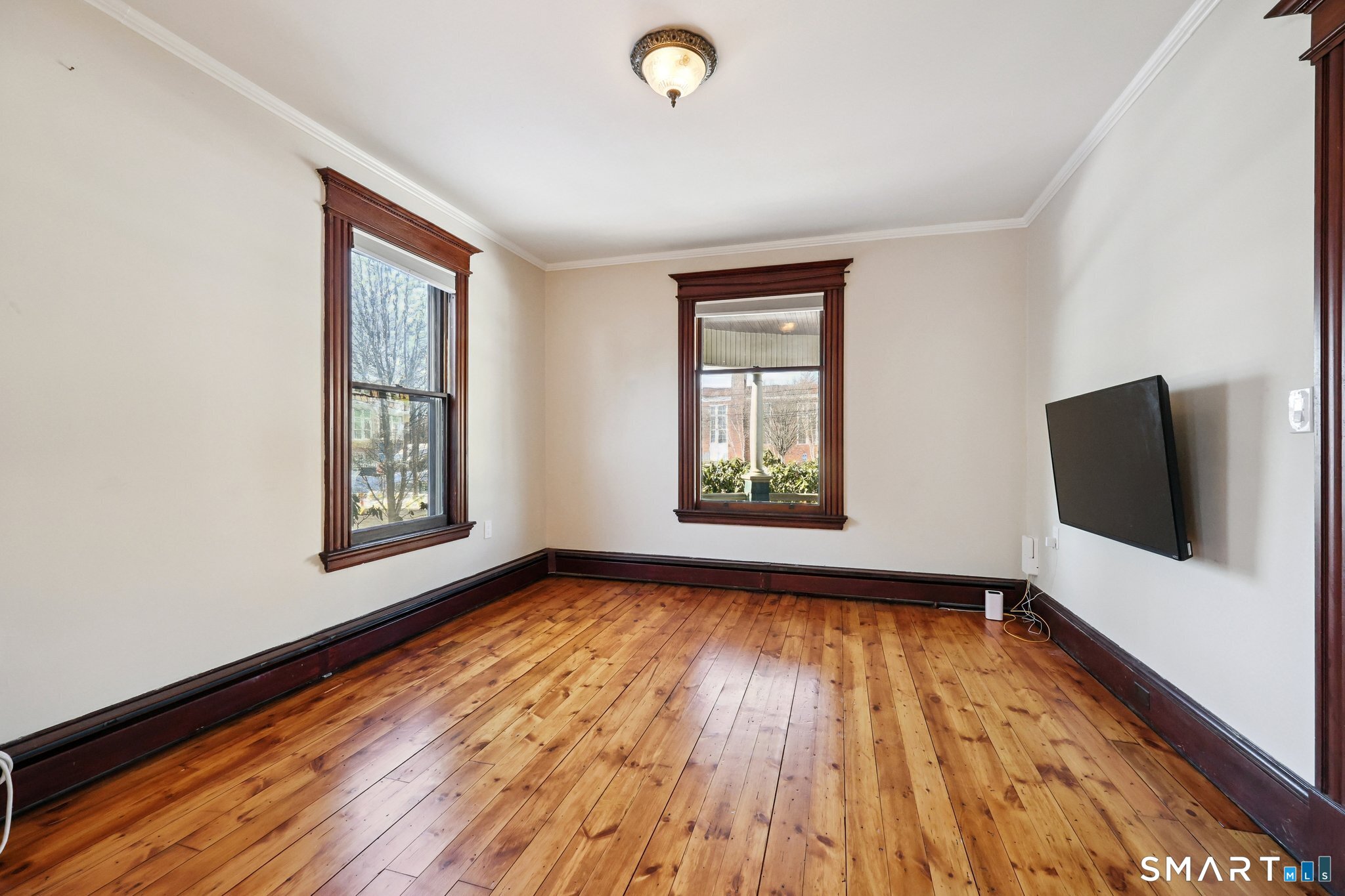 56 Whitney Street Hartford, CT 06105 - Photo 8 of 40 wooden floor in an empty room with a window