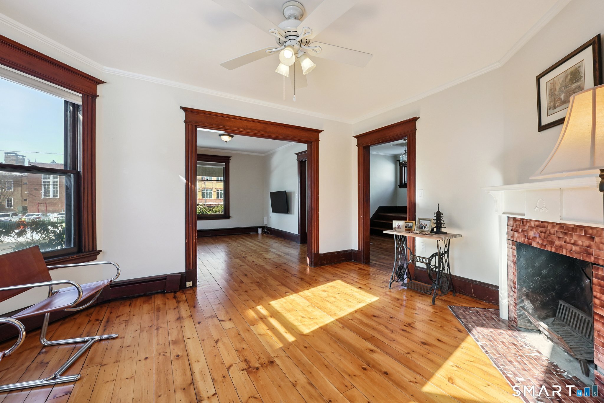 56 Whitney Street Hartford, CT 06105 - Photo 10 of 40 a living room with furniture and a fireplace