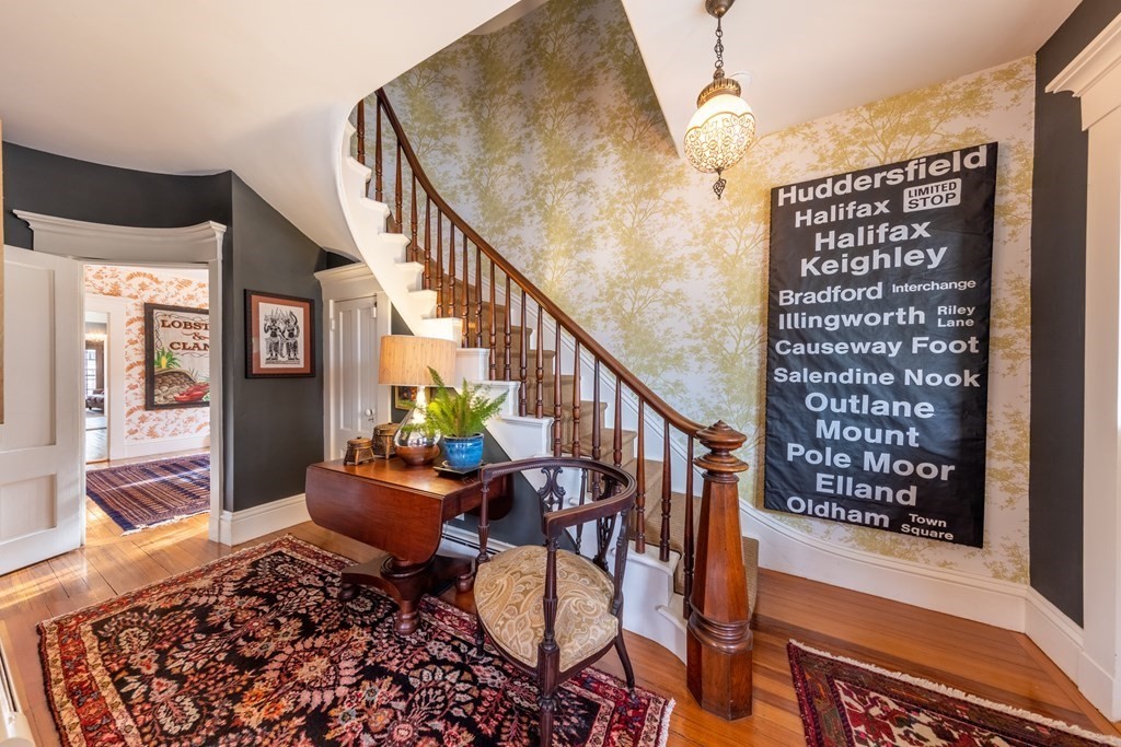 a balcony with furniture and a potted plant
