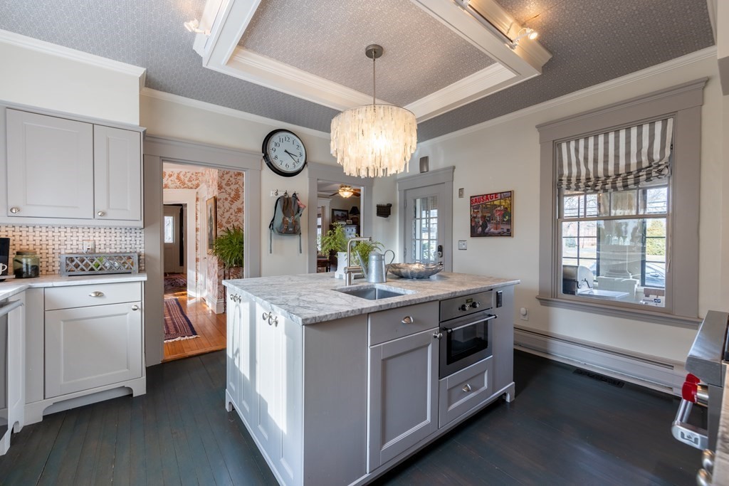 41 Union Street Fairhaven, MA 02719 - Photo 18 of 41 a kitchen that has a lot of white cabinets and stainless steel appliances