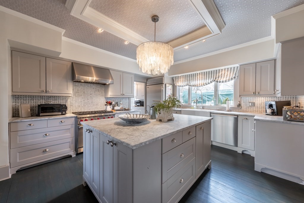 41 Union Street Fairhaven, MA 02719 - Photo 21 of 41 a kitchen with kitchen island granite countertop stainless steel appliances sink cabinets and window