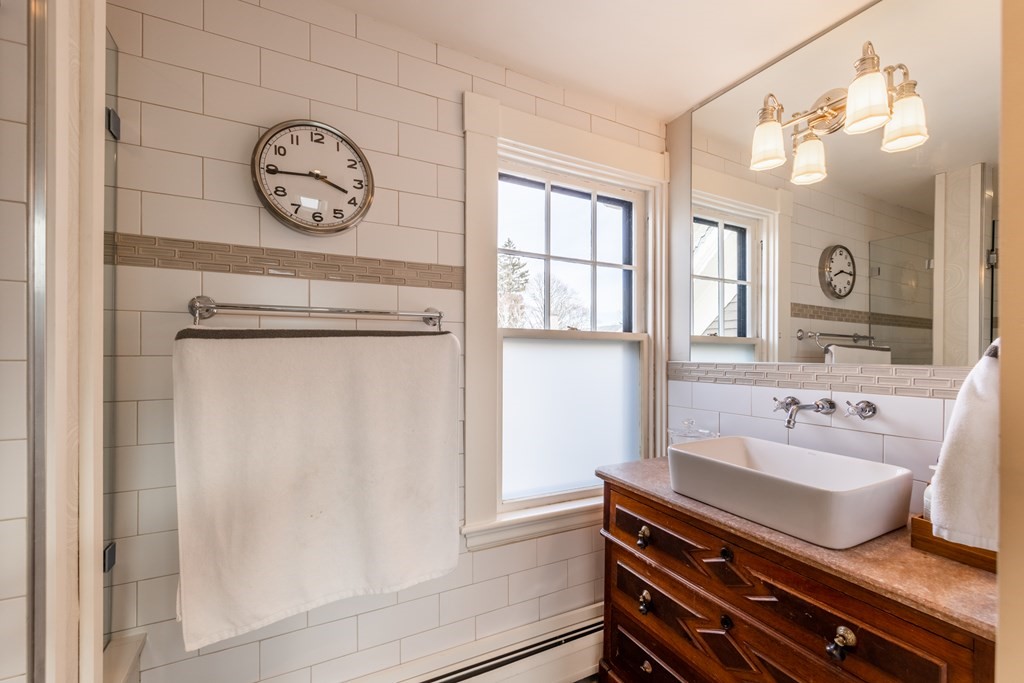 41 Union Street Fairhaven, MA 02719 - Photo 30 of 41 a bathroom with a toilet a sink and a mirror