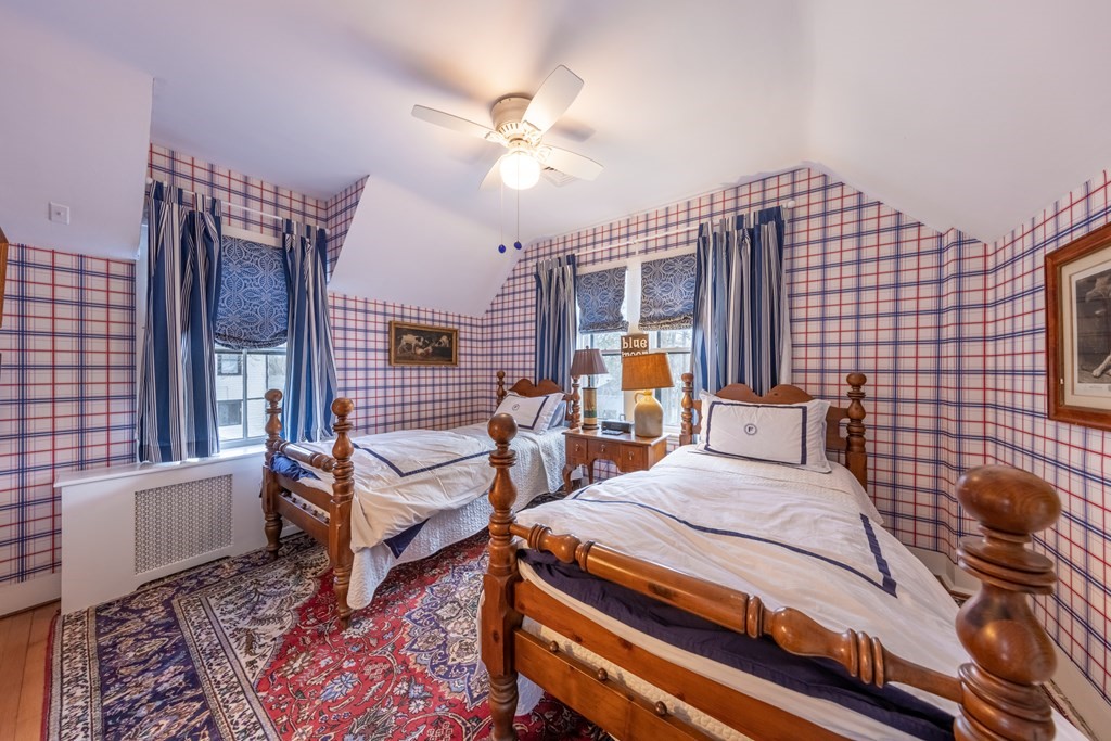 41 Union Street Fairhaven, MA 02719 - Photo 33 of 41 a bedroom with a bed and a chandelier