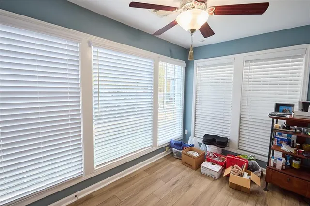 a bedroom with furniture and a window